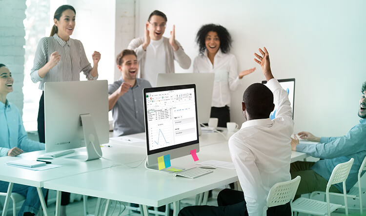 photograph of diverse group of employees at tech company, excited/celebrating