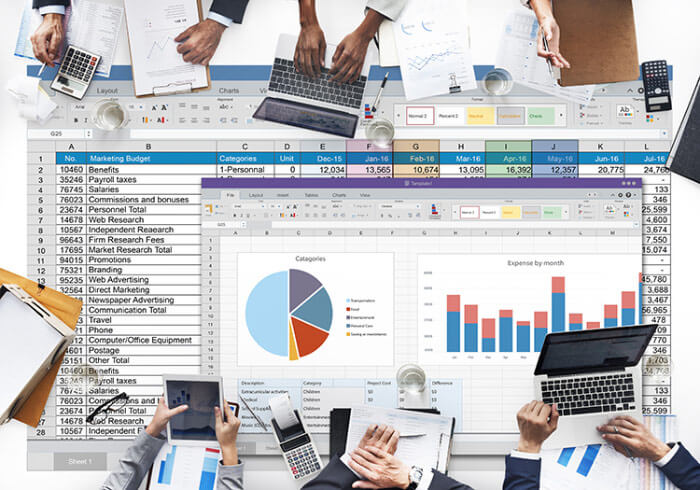 conceptual photograph of excel sheet reports with many hands and devices overlapping